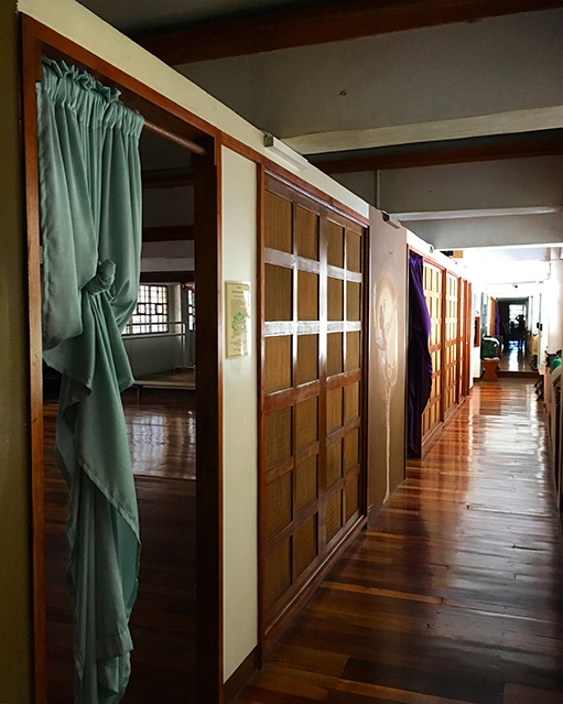 The hallway in One Yoga studio. Rattan is used as a divider for the rooms. 