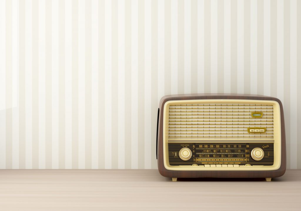 Retro radio in striped painted background